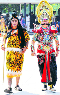 Artistes playing the roles of Lord Shiva and Ravana take a stroll at Sector 17 in Chandigarh on Wednesday