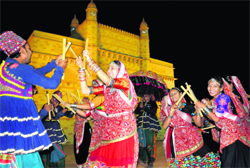 Artistes from Bhavnagar in Gujarat perform dandiya on the first day of the Navratras at Dashera Mela at Sector 34 in Chandigarh on Wednesday