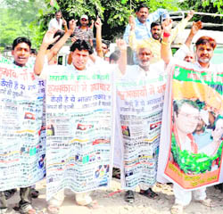 Congress activists stage a protest in Haridwar on Wednesday. 