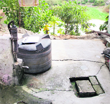 a cesspool near a hand pump at Guru Nanak Pura (East)
