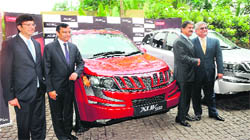 Mahindra & Mahindra (M&M) officials at the launch of XUV 500 in Pune on Thursday. The car offers a 2.2-litre M-Hawk engine that gives a maximum power output of 140 Bhp and 15.1 km per litre mileage. The three variants of the car would be produced at the companys Chakan plant, located on the outskirts of Pune.