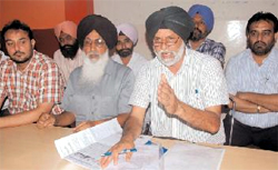 Transporters narrate their grievances at a press meet held in the city on Thursday