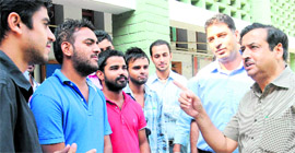 Pawan Kumar Jain, newly appointed officiating principal, interacts with students at DAV College in Chandigarh on Thursday.