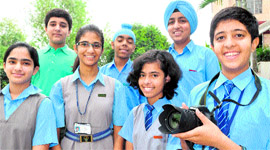 Students of Vivek High School all smiles before leaving for Singapore to attend a workshop in Chandigarh on Thursday.