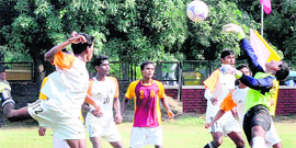 A goalkeeper parries the ball during a match at Sector 42, Chandigarh, on Thursday.