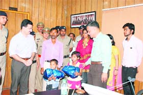 Uttarakhand Director-General of Police JS Pandey meets the children who were united with their family by the police, in Dehradun on Thursday
