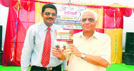 Dr KL Johar (right), a former Vice-Chancellor of Guru Jambeshwar University, releases a book Entrepreneurship Development written by Dr MK Sehgal in Yamunanagar.