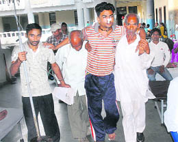 In the absence of staff, a gastroenteritis patient being helped by his relatives into a ward at the Civil Hospital in Jalandhar on Thursday.