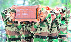 Armymen carry the coffin containing the body of Lt Sushil Khajuria during a ceremony at a military garrison in Srinagar on Thursday.