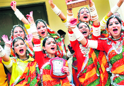 Students of Arya College celebrate after winning a group dance competition in the Zonal Youth Festival in Ludhiana