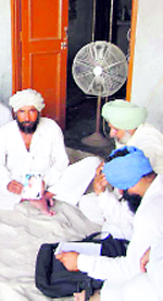 Gurpreet's family members in Charik village after his cremation. The family got to know about the death three weeks after the incident