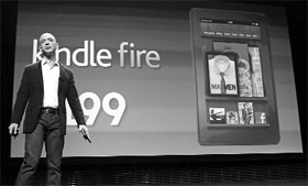 Amazon CEO Jeff Bezos demonstrates the new Kindle Fire tablet as he speaks at a news conference during the launch of Amazons new tablets in New York, on September 28, 2011.