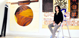 Nishi Chandra with her works in Dehradun on Friday.