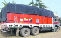 A file photo of a truck loaded with bags of wheat at Kalanwali in Sirsa