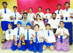 The winning team is all smiles while posing for a photograph