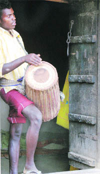 With the beat of drums, Adivasis seek the blessings of gods and goddesses