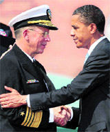President Barack Obama bids farewell to Admiral Mike Mullen, Chairman of the Joint Chiefs of Staff, in Arlington on Friday.