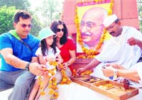 Residents paying floral tributes to Mahatma Gandhi in Amritsar on Sunday. 