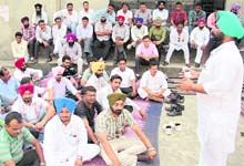 Members of the ETT Teachers Union hold a meeting at the Desh Bhagat Yadgaar Hall in Jalandhar on Sunday. 