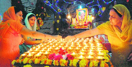 Women light 108 diyas during Navratras in Amritsar on Sunday