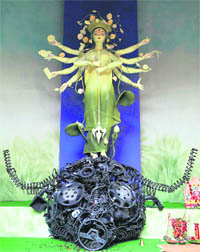 Goddess Durga stands as a destroyer of pollution at a community puja pandal in Kolkata on Sunday. 