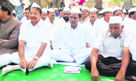 Pro-Telangana activists led by TRS chief K Chandrasekhar Rao during a sit-in at Rajghat in New Delhi on Sunday. 