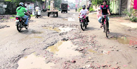 A pot-holed road in Partap Bagh area of Amritsar that leads to the Golden Temple.