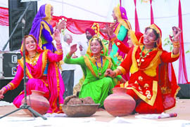 Students perform Giddha during the Zonal Youth Festival at Baba Farid college in Bathinda on Monday. 
