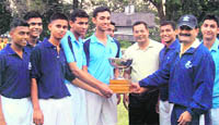 The winners of the inter-section volleyball tournament are presented the trophy by Col PK Kumaria, Commandant, RIMC, in Dehradun