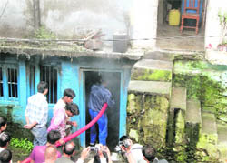 Firemen douse the flames at Char Dukan in Mussoorie