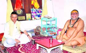 Former Uttarakhand Chief Minister Bhagat Singh Koshyari (left) with Jagadguru Shankaracharya Raj Rajeshwaram at his ashram at Kankhal in Haridwar on Monday.