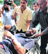 An injured being taken to a hospital in Jammu.