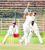 A Hyderabad player hits a straight drive against Bengal for the Dhruve Pandove Trophy in Sector 16, Chandigarh, on Tuesday.