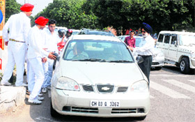 School students spread the message of staying behind zebra crossings as part of an awareness drive of the traffic police in Chandigarh on Tuesday.