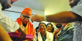 Senior BJP leader L. K. Advani and his wife felicitated by the Delhi unit of SAD (Badal) at a function for his Jan Chetna Yatra in New Delhi on Tuesday. 