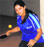 A player in action in the Inter-council School Table Tennis Tournament in Dehradun