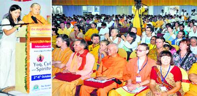 An expert (left) addresses participants in an international yoga festival in Haridwar on Tuesday
