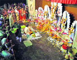 Devotees offer prayers on the occasion of Durga Ashtami at the Kalibari Temple in Shimla on Tuesday