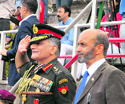 Gen VK Singh, along with Headmaster Praveen Vasisht, inspects a parade at The Lawrence School, Sanawar, on Tuesday