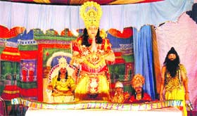 Artistes enact a scene from Ramlila at Sainik Colony in Jammu