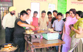 Juveniles learn to make burgers in Ludhiana on Tuesday. 