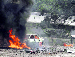 A car burns at the scene of a suicide attack in Somalia's capital Mogadishu on Tuesday