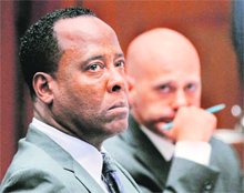 Michael Jacksons doctor, Conrad Murray (left) attends his trial in connection with the death of the pop star in Los Angeles. Prosecutors in the manslaughter trial of Dr Murray sought to prove on Monday that the physician misled hospital doctors on the day of MJs death and was busy on his phone around the time the pop star stopped breathing