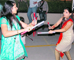 To add a Gujarati flavour to Navratra celebrations, girls enjoy themselves to the tune of traditional dandiya at an event organised by Alpha One in Amritsar on Wednesday