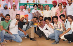 Winners of the Zonal Youth Festival - 2011 of the Punjabi University Patiala display trophy in Bathinda