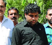 Ravinder, involved in the murder of a Delhi police constable, being produced at a court in New Delhi