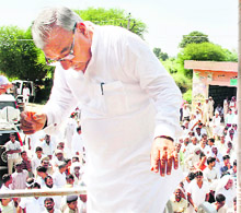 Chief Minister Bhupinder Singh Hooda during a roadshow organised by the Congress in the Uchana assembly segment on Wednesday