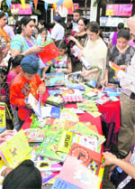 Students and parents select books during a book fair which concluded at Guru Nanak Public School, Model Town Extension, in Ludhiana