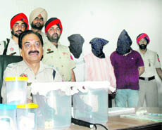ADCP City-I Satpal Joshi showing the weapons recovered from the three looters nabbed by the city police. 