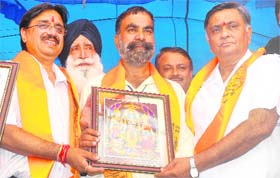 BJP leaders Mayor Rakesh Rathour and former Local Bodies Minister Manoranjan Kalia at a Dasehra function on Ladowali Road in Jalandhar on Thursday
